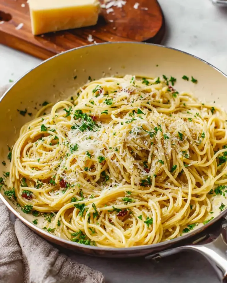 One Pot Spaghetti with Sun-Dried Tomatoes and Parmesan served in a bowl