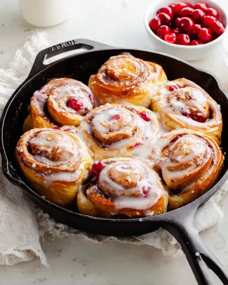 Cherry cream cheese pinwheels served on a plate for a delicious appetizer.