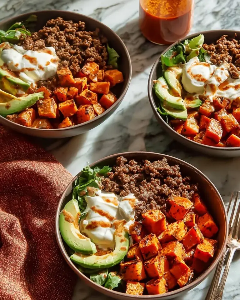Cottage cheese ground beef bowls topped with fresh vegetables and spices