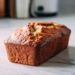 Healthy banana bread made with almond flour on a wooden cutting board