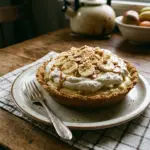 Delicious homemade Banana Cream Pie with fresh bananas and whipped cream topping.